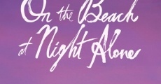 On the beach at night alone